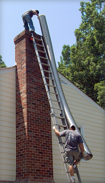 Cougots crew cleaning a chimney